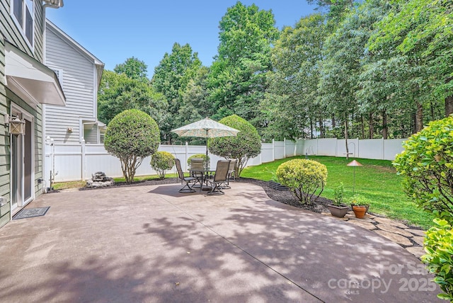 18732 Coachmans Trce, Cornelius, NC 28031 - fenced backyard featuring a patio area and outdoor dining space