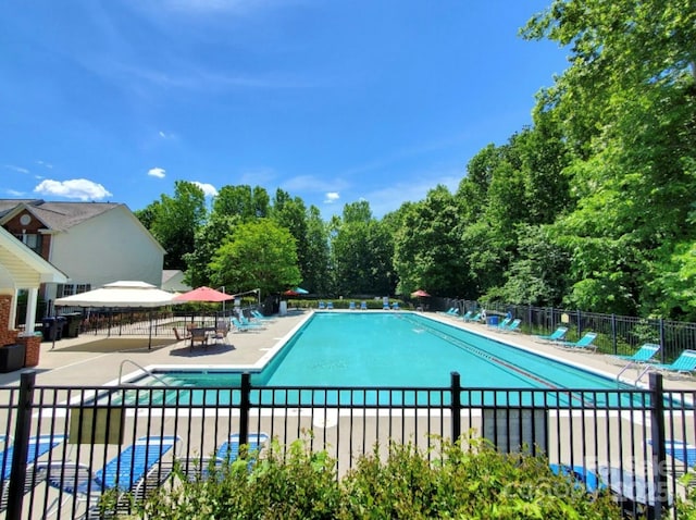 18732 Coachmans Trce, Cornelius, NC 28031 - community pool featuring a patio area