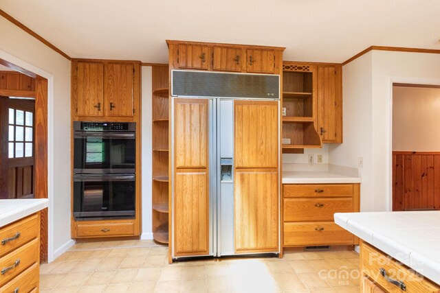 18 Gravely Branch Rd, Fletcher, NC 28732 - kitchen featuring paneled built in fridge, open shelves, tile countertops, ornamental molding, and brown cabinets