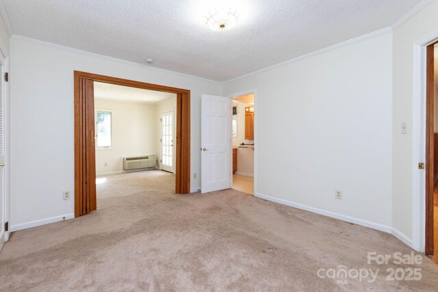 18 Gravely Branch Rd, Fletcher, NC 28732 - unfurnished bedroom featuring ornamental molding, carpet, and a textured ceiling