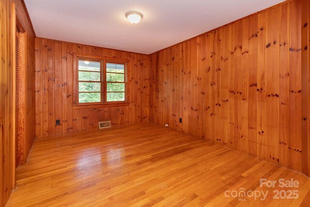 18 Gravely Branch Rd, Fletcher, NC 28732 - unfurnished room with wood finished floors and wood walls