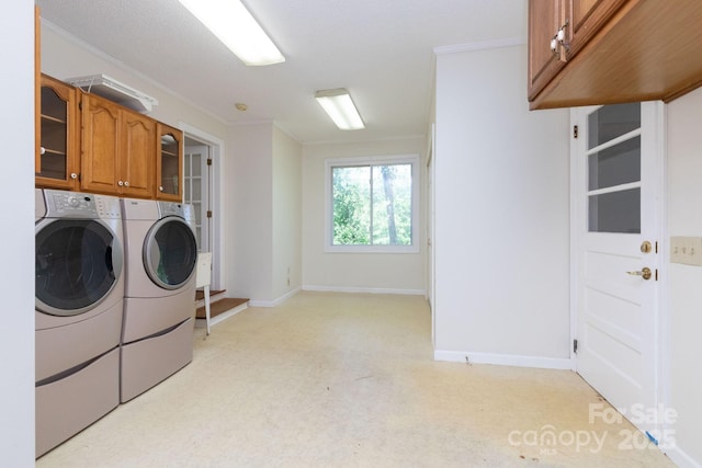 18 Gravely Branch Rd, Fletcher, NC 28732 - washroom featuring cabinet space, washing machine and dryer, crown molding, and light colored carpet