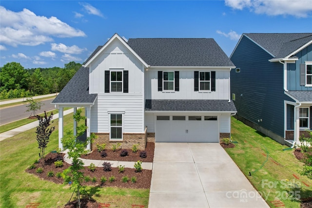 12009 Grinstead Ln Unit 303, Charlotte, NC 28278 - traditional-style home with board and batten siding, brick siding, concrete driveway, and an attached garage