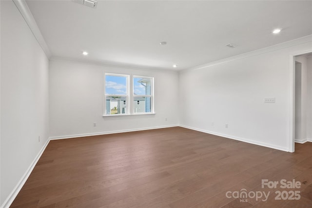 12009 Grinstead Ln Unit 303, Charlotte, NC 28278 - spare room featuring ornamental molding, dark wood-style flooring, baseboards, and recessed lighting