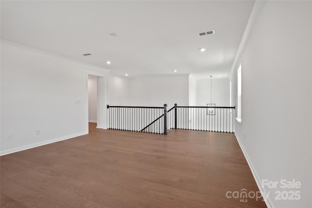 12009 Grinstead Ln Unit 303, Charlotte, NC 28278 - unfurnished room featuring wood finished floors, baseboards, recessed lighting, and ornamental molding