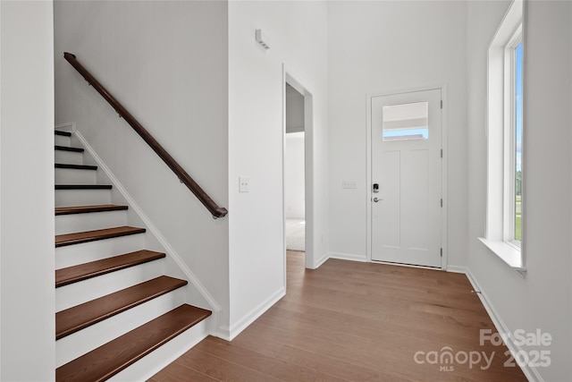 12009 Grinstead Ln Unit 303, Charlotte, NC 28278 - entryway featuring wood finished floors, stairs, and baseboards