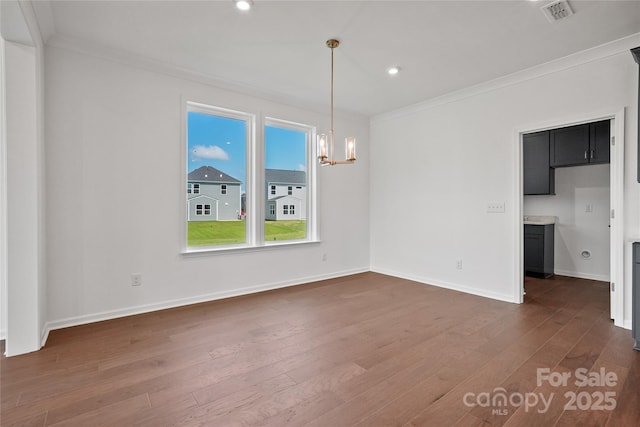 12009 Grinstead Ln Unit 303, Charlotte, NC 28278 - unfurnished dining area with crown molding, a chandelier, dark wood finished floors, recessed lighting, and baseboards