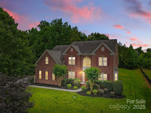 3213 Strawberry Rd, Matthews, NC 28104 - colonial home featuring a yard and brick siding