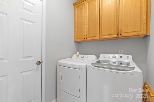 3213 Strawberry Rd, Matthews, NC 28104 - laundry area featuring cabinet space and washer and clothes dryer