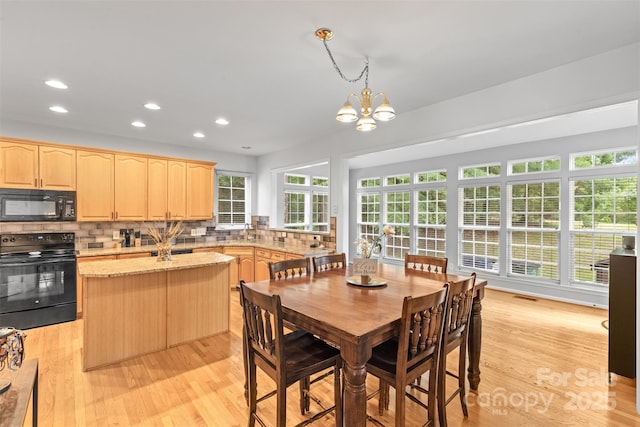 3213 Strawberry Rd, Matthews, NC 28104 - dining space featuring a chandelier, light wood finished floors, and recessed lighting