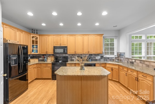 3213 Strawberry Rd, Matthews, NC 28104 - kitchen featuring black appliances, a sink, light wood-type flooring, decorative backsplash, and recessed lighting