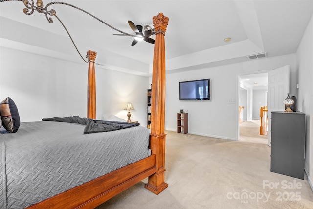 3213 Strawberry Rd, Matthews, NC 28104 - bedroom with light carpet, baseboards, a ceiling fan, and a tray ceiling