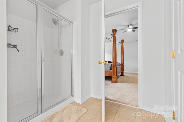 3213 Strawberry Rd, Matthews, NC 28104 - ensuite bathroom featuring a stall shower, tile patterned flooring, baseboards, and a ceiling fan