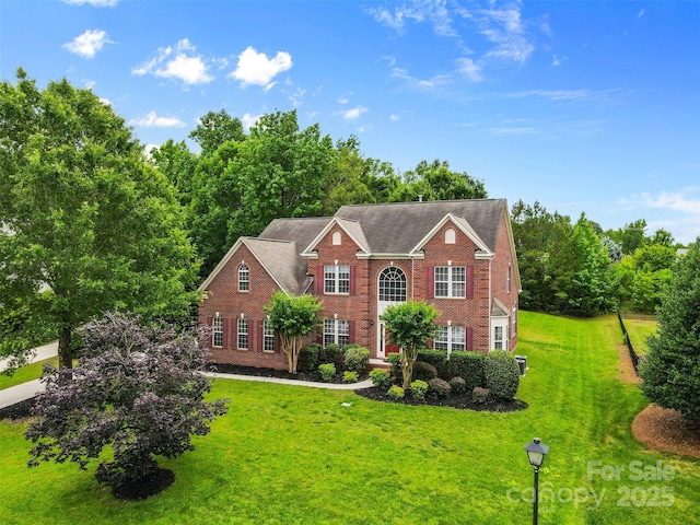 3213 Strawberry Rd, Matthews, NC 28104 - colonial home featuring brick siding and a front lawn