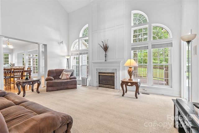 3213 Strawberry Rd, Matthews, NC 28104 - carpeted living room featuring high vaulted ceiling and a fireplace