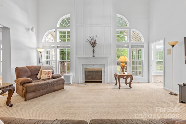 3213 Strawberry Rd, Matthews, NC 28104 - carpeted living area with a towering ceiling, healthy amount of natural light, and a premium fireplace