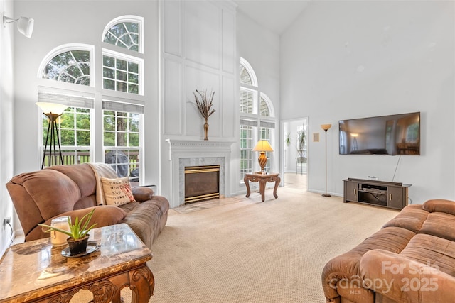 3213 Strawberry Rd, Matthews, NC 28104 - carpeted living room featuring a high ceiling and a high end fireplace
