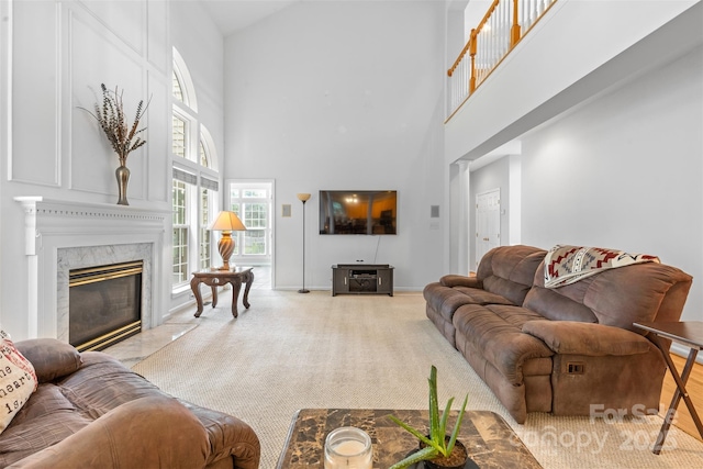 3213 Strawberry Rd, Matthews, NC 28104 - living area with a high ceiling, a high end fireplace, baseboards, and carpet