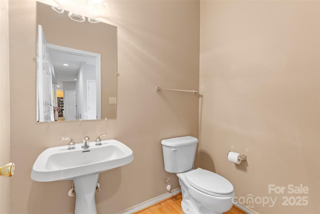 3213 Strawberry Rd, Matthews, NC 28104 - bathroom with toilet and wood finished floors