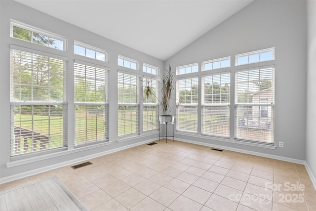 3213 Strawberry Rd, Matthews, NC 28104 - unfurnished sunroom with tile patterned floors, baseboards, and high vaulted ceiling