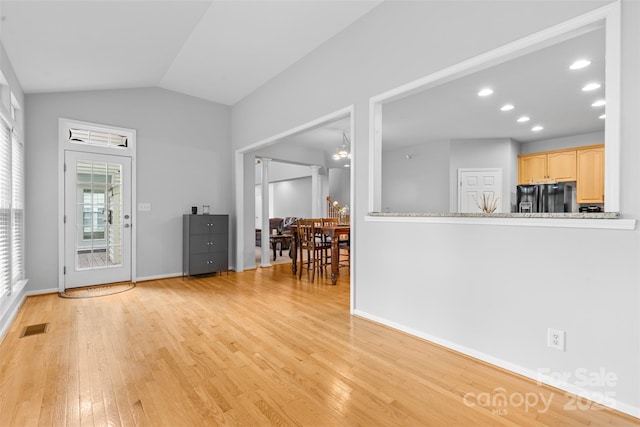 3213 Strawberry Rd, Matthews, NC 28104 - living room featuring light wood-style flooring, recessed lighting, baseboards, and lofted ceiling