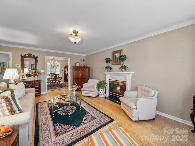 1634-B Union Rd, Gastonia, NC 28054 - living area featuring a chandelier, ornamental molding, wood finished floors, and a fireplace with flush hearth