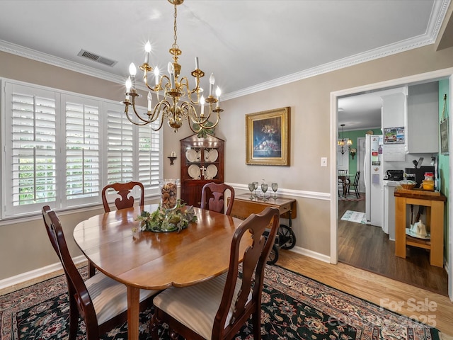 1634-B Union Rd, Gastonia, NC 28054 - dining area with a chandelier, wood finished floors, and crown molding