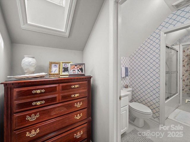 1634-B Union Rd, Gastonia, NC 28054 - full bath featuring tile patterned floors, bath / shower combo with glass door, lofted ceiling, tile walls, and vanity