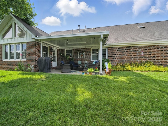 1634-B Union Rd, Gastonia, NC 28054 - rear view of house with brick siding, a patio, a lawn, and outdoor lounge area
