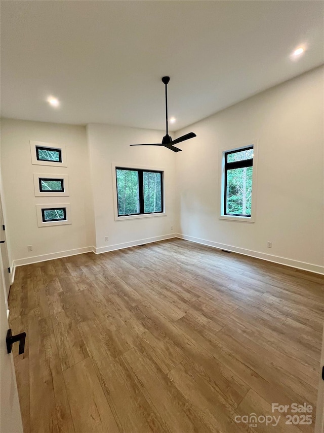 908 Apex Dr, Albemarle, NC 28001 - spare room with plenty of natural light, wood finished floors, recessed lighting, ceiling fan, and baseboards