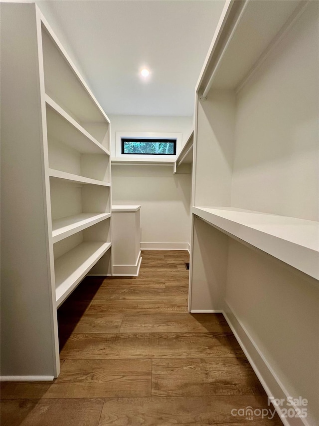 908 Apex Dr, Albemarle, NC 28001 - spacious closet featuring dark wood-style floors