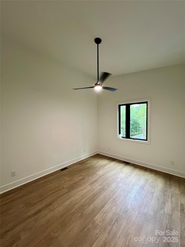 908 Apex Dr, Albemarle, NC 28001 - unfurnished room with ceiling fan, dark wood-style flooring, and baseboards