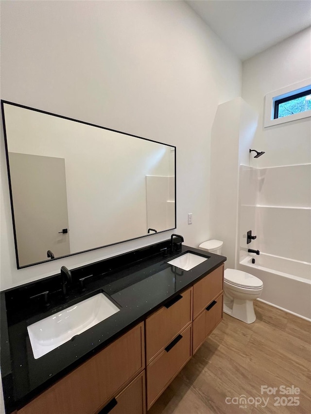 908 Apex Dr, Albemarle, NC 28001 - bathroom featuring toilet, double vanity, and wood finished floors