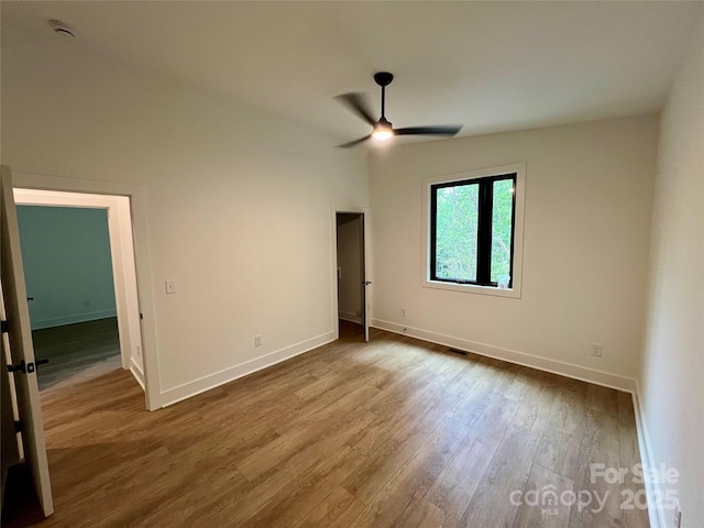 908 Apex Dr, Albemarle, NC 28001 - spare room with ceiling fan, wood finished floors, and baseboards
