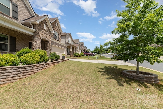 5098 Burnwald Ct, Fort Mill, SC 29715 - view of green lawn with a garage, concrete driveway, and a residential view