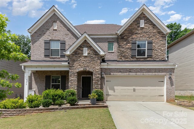 5098 Burnwald Ct, Fort Mill, SC 29715 - view of front of home with driveway, an attached garage, a front lawn, and stone siding