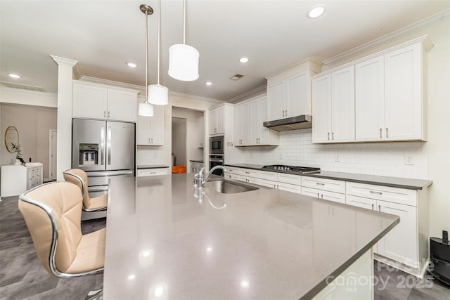 5098 Burnwald Ct, Fort Mill, SC 29715 - kitchen featuring stainless steel appliances, ornamental molding, under cabinet range hood, a large island, and a breakfast bar area