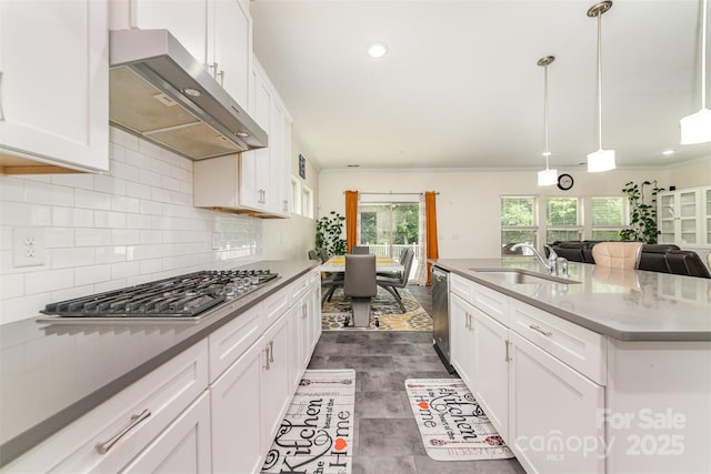 5098 Burnwald Ct, Fort Mill, SC 29715 - kitchen with wall chimney range hood, appliances with stainless steel finishes, decorative backsplash, white cabinets, and recessed lighting