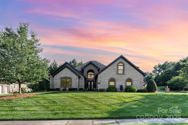 3441 Club Ridge Ct, Gastonia, NC 28056 - french country style house with brick siding, a front lawn, and french doors