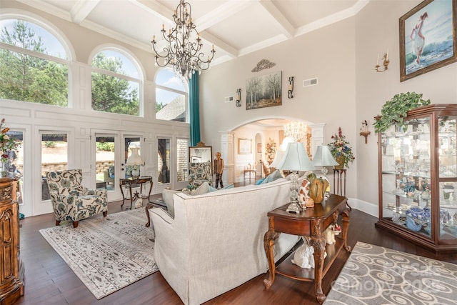 3441 Club Ridge Ct, Gastonia, NC 28056 - living room with a towering ceiling, a chandelier, dark wood-type flooring, beamed ceiling, and arched walkways