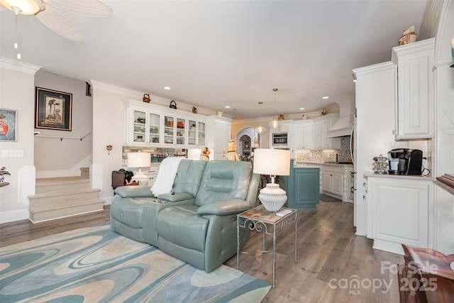 3441 Club Ridge Ct, Gastonia, NC 28056 - living room with wood finished floors, arched walkways, recessed lighting, stairway, and ceiling fan
