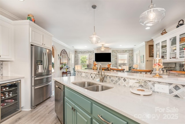 3441 Club Ridge Ct, Gastonia, NC 28056 - kitchen with stainless steel appliances, beverage cooler, white cabinetry, light wood-style floors, and light countertops