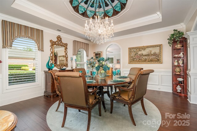3441 Club Ridge Ct, Gastonia, NC 28056 - dining room featuring a tray ceiling, healthy amount of natural light, crown molding, dark wood finished floors, and wainscoting
