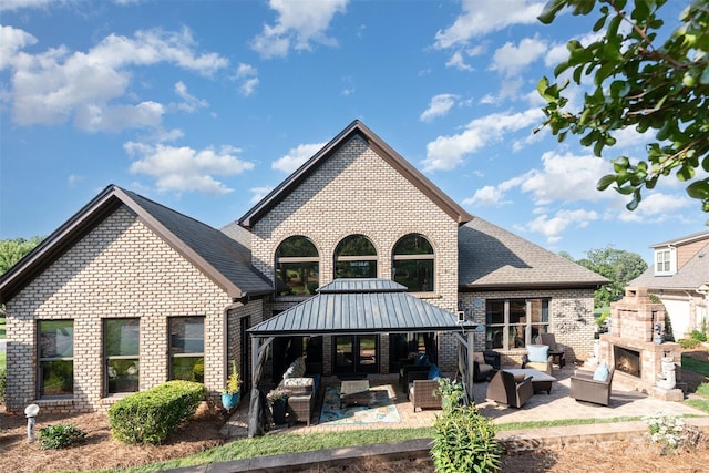 3441 Club Ridge Ct, Gastonia, NC 28056 - back of house with an outdoor living space with a fireplace, brick siding, a gazebo, and a patio area