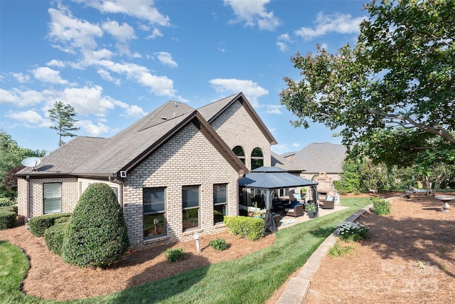 3441 Club Ridge Ct, Gastonia, NC 28056 - view of side of property with brick siding, an outdoor hangout area, a gazebo, a patio, and a shingled roof