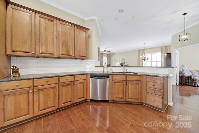 964 Knob Creek Ln, Fort Mill, SC 29708 - kitchen featuring stainless steel dishwasher, a chandelier, brown cabinetry, and ornamental molding