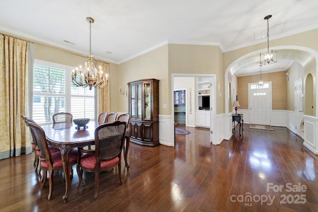 964 Knob Creek Ln, Fort Mill, SC 29708 - dining area with a chandelier, arched walkways, healthy amount of natural light, dark wood-type flooring, and wainscoting