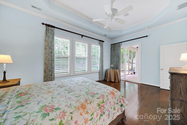 964 Knob Creek Ln, Fort Mill, SC 29708 - bedroom featuring crown molding, a raised ceiling, dark wood-style floors, access to outside, and a ceiling fan