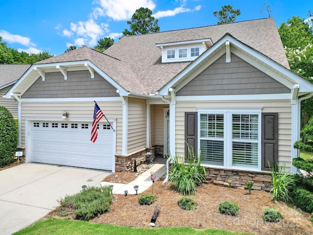 964 Knob Creek Ln, Fort Mill, SC 29708 - view of front facade featuring an attached garage, a shingled roof, stone siding, and concrete driveway