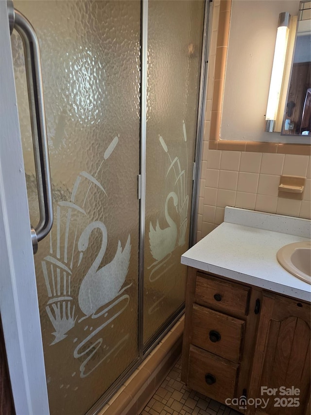4298 NC-41 Hwy S, Fairmont, NC 28340 - bathroom featuring tile walls, a shower stall, and vanity